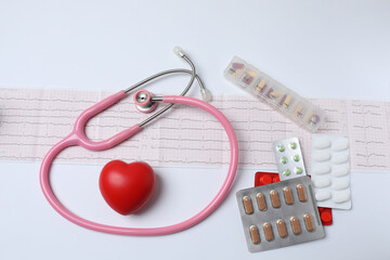 stethoscope, large pile of multi-colored pills in blister pack disposable , close-up