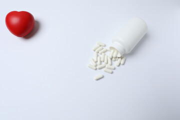pills in jars on a white background