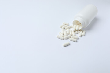 pills in jars on a white background