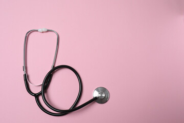 Fototapeta premium medical stethoscope on a pink background