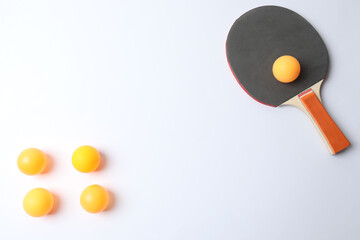 Ping pong racket with the ball for playing table tennis on a colored background