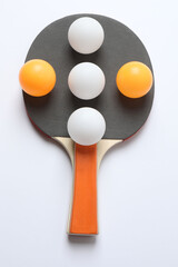 Ping pong racket with the ball for playing table tennis on a colored background