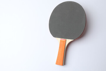 Ping pong racket with the ball for playing table tennis on a colored background