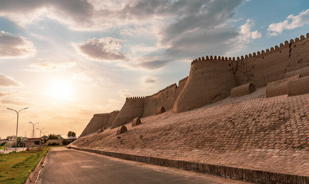 A road with a wall on the side - Powered by Adobe