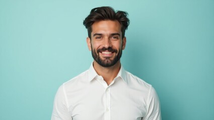 Fototapeta premium Mildy. Smiling young man with beard wearing white shirt on blue backgr
