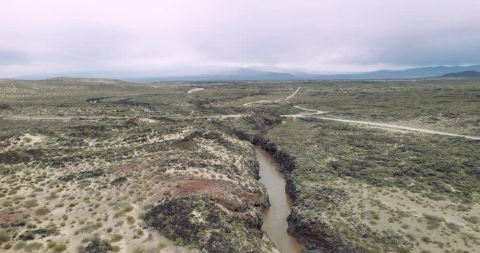 Aerial view of La Payunia, in Mendoza. with full of no active volcanoes on a  cloudy day