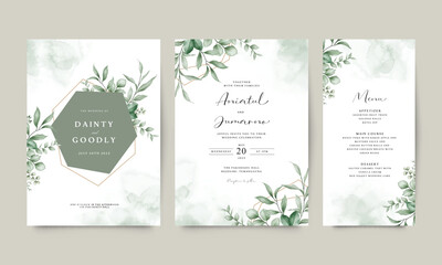 Elegant wedding invitation card set with geometric frame arranged with green leaves