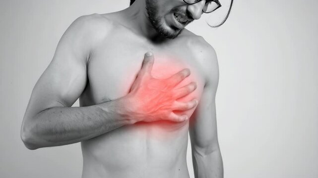 Man clutching chest in pain with red highlight, heart health concern