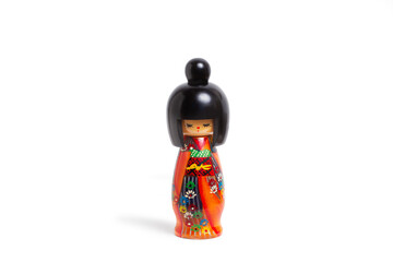 A japanesse doll isolated on a white background with copy space