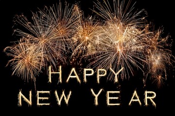 Bright fireworks and 'Happy New Year' text against a night sky celebrating the arrival of the new year.