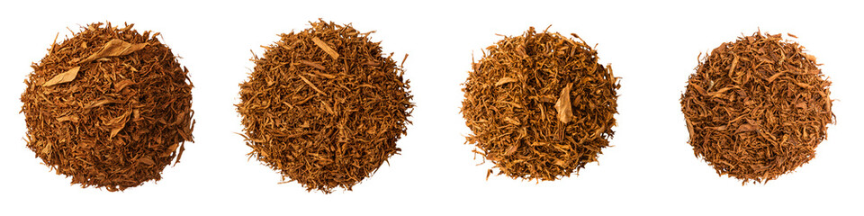 Piles of dried, cured tobacco leaves.