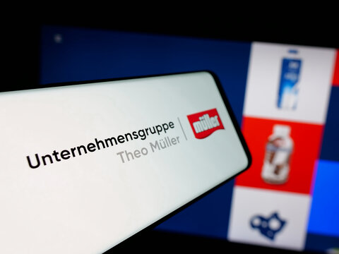 Stuttgart, Germany - 04-24-2025: Smartphone with logo of dairy company Unternehmensgruppe Theo M&uuml;ller on screen in front of website. Focus on center-left of phone display.