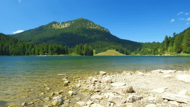 Scenic hiking adventure near Brecherspitz with crystal-clear waters of Spitzingsee and vibrant alpine landscapes in southern Bavaria