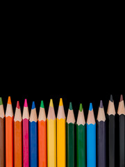 Colored pencils lined up in frame