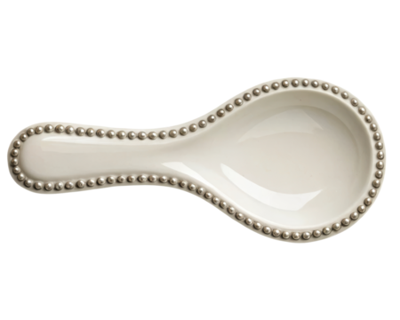 Ceramic kitchen spoon rest with decorative beaded edge design on a transparent background