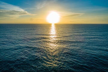 Aerial view sunset sky,Nature beautiful light sunset or sunrise over sea surface,Colorful sunset sky with clouds and waves in the ocean,Wide angle sea background