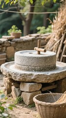 Naklejka premium Traditional Stone Mill in an Outdoor Setting