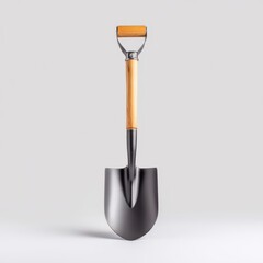 A close up shot of a metal shovel with a wooden handle against a plain backdrop