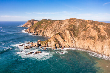 Breathtaking aerial view of Point Reyes, California, showcasing dramatic coastal cliffs surrounded by the Pacific Ocean. A stunning destination for nature lovers, photographers, and outdoor