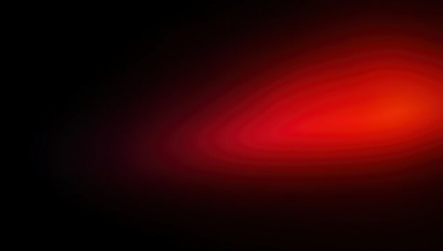 A soft, abstract red glow gradually fades into deep black, creating a smooth, radiant gradient effect.