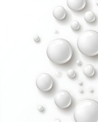 White, glossy spheres of varying sizes are scattered across a clean white background, resembling droplets or pearls