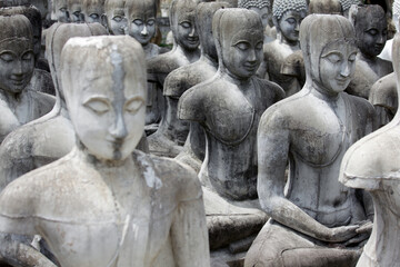 Fototapeta premium Serene Garden of Stone Statues in Peaceful Contemplation