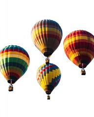 Fototapeta premium Four colorful hot air balloons soaring in the sky. Each balloon displays a unique pattern of stripes and geometric shapes in various hues