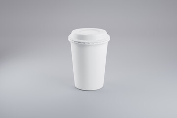 mockup of paper coffee cup standing on plain background. minimalist concept