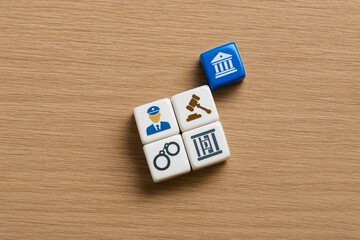 Justice System Legal Concept Cubes Police Officer Gavel Handcuffs Prison Court Building Law Enforcement Criminal Justice Abstract Blocks Wooden Background Legal Theme Symbolic Representation Justice  