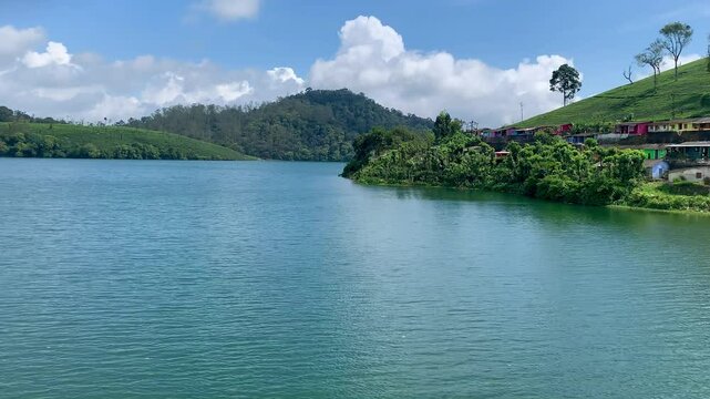 Lush green tea plantation at Valparai, The beautiful Valparai river meanders through the estate. Kerala tourism. God's own country. 