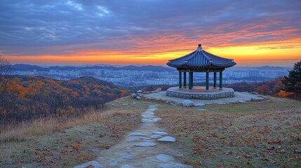 Autumnal sunrise view of pavilion on hilltop