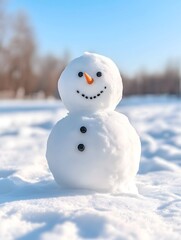 Obraz premium A cheerful snowman stands in a snowy field under a bright blue sky