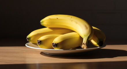 Fresh bananas piled on a plate illuminated by natural sunlight