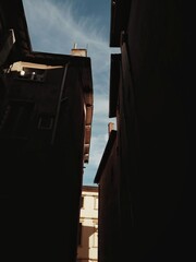 The sky between the roof and the contrast of light in the city center.