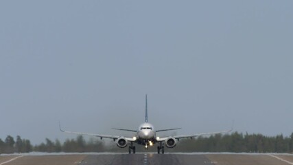 Airplane landing on runway