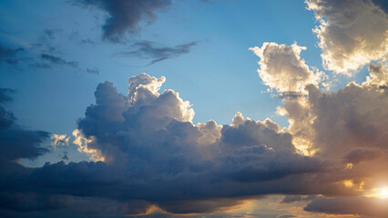 Golden sunset sky background, golden clouds, evening with the sun setting.