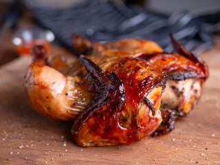 Whole Grilled Chicken on Wooden Table.