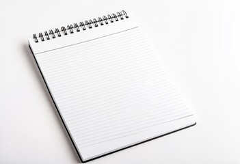 A spiral notebook on a white surface.