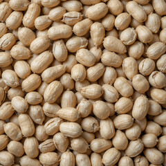 Food background with raw unshelled peanuts flat lay composition