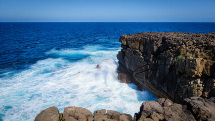 waves crashing on rocks