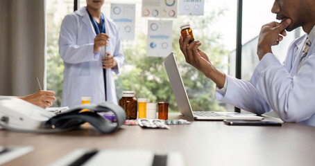 Doctor analyzing medication while discussing treatment options