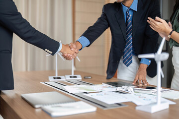 ESG and Sustainability: Business hands shaking to formalize an agreement