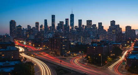 City skyline at dusk with highway traffic