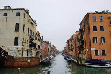 Old houses facades and channel in the old center of Venice, Italy     