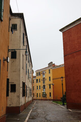 Old houses facades and channel in the old center of Venice, Italy     