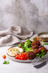 Salad with hummus, falafel and vegetables