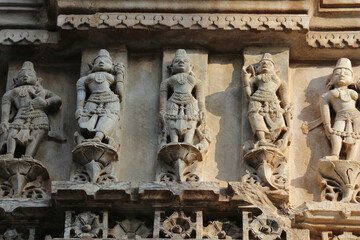 Detail of decorative stone carvings on the walls of the Jagdish Temple in Udaipur, Rajasthan,...