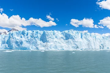 Fototapete Rund Massive glaciers calving into the ocean under a clear blue sky, showcasing nature's raw power and beauty © pavlofox