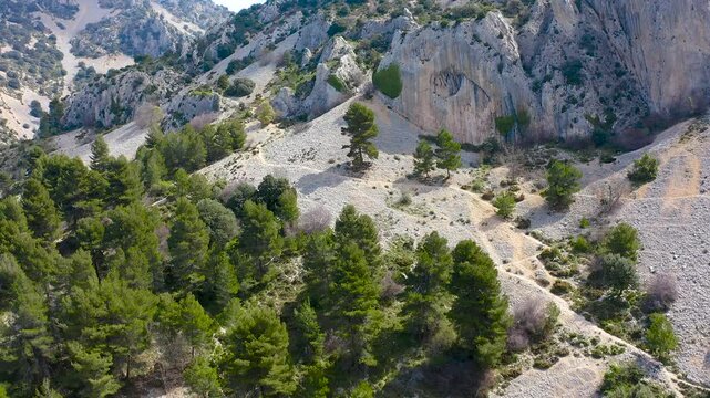 Aerial view of Els Frares. The topography, with its rock formations, casts a striking silhouette. Its striking structures resemble monks turned to stone, in Alicante, Spain.
