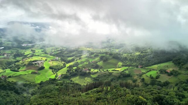 A stunning aerial view showcases vibrant greenery and cloudy skies, perfect for exploring and appreciating nature